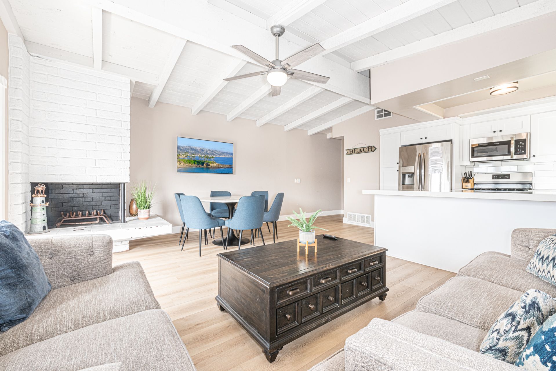 The main living area has plenty of space, with a sofa and love seat, streaming TV, dining area with seating for 5, and doors that open out to the front balcony. The fireplace has been permanently disabled.